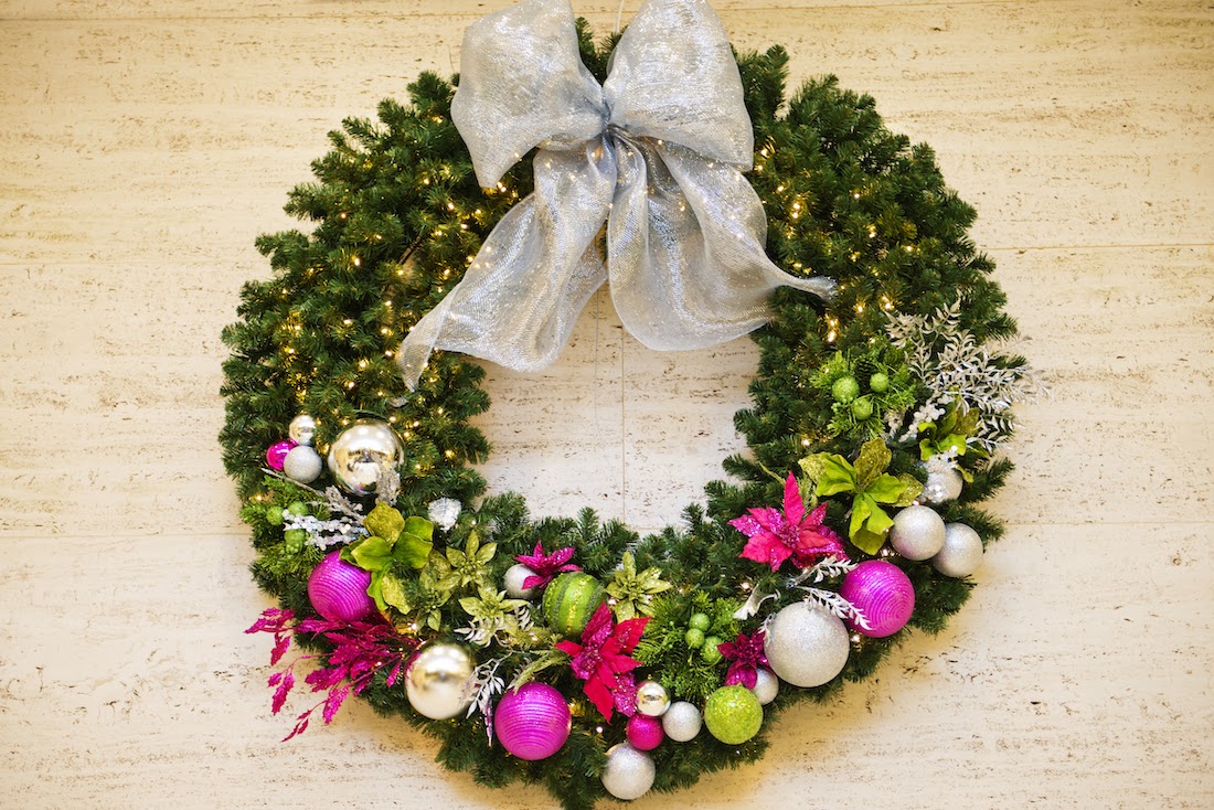 A holiday wreath with colorful ornaments